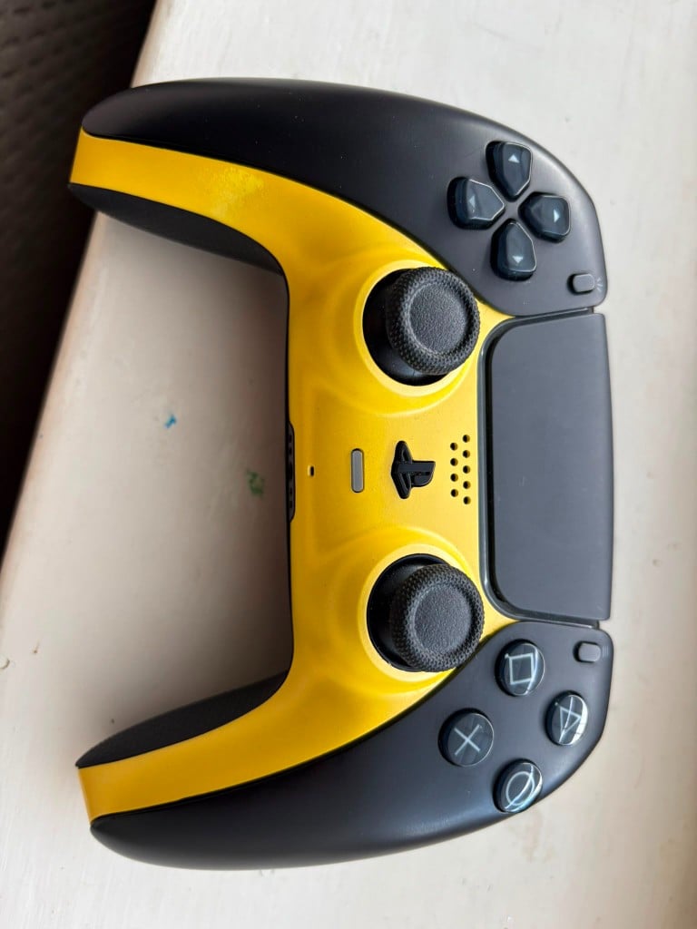 Custom yellow and black DualSense controller