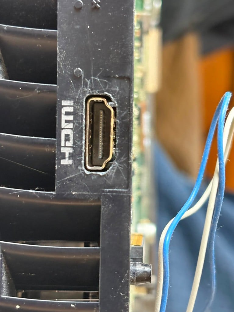 Damaged HDMI port on the back of an Xbox Series X